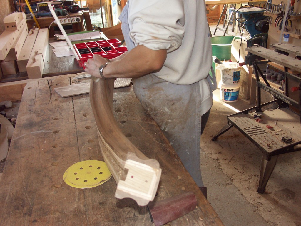 Sanding down a wreathed hand rail