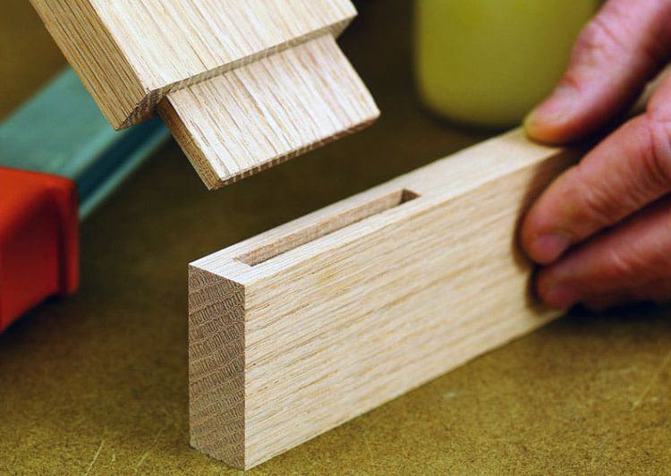 A mortise and tenon joint being assembled